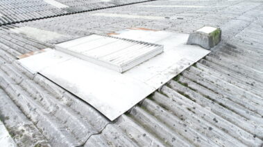 Original asbestos roof prior to overcladding transformation.