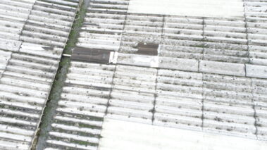 Detailed view of the asbestos roof before overclad process.