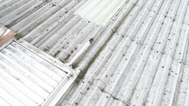 Asbestos roof of the building captured at a unique angle.