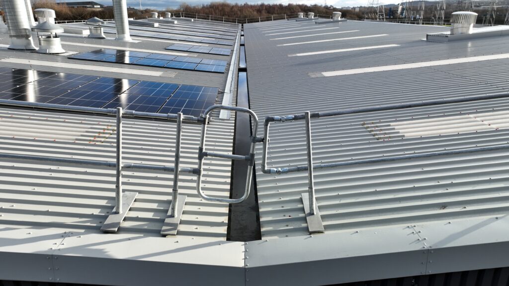Image highlighting the solar panels embedded in the metal profiled roof