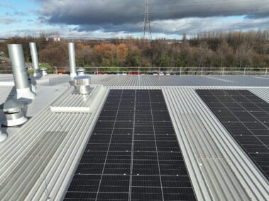 Detailed image showing the solar PV system on the metal profiled roof.
