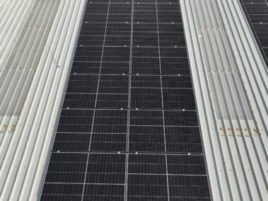 Aerial view of the energy-efficient metal profiled roof and solar PV system