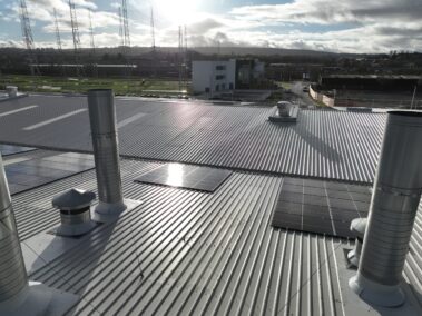 Angular shot showing the aesthetic appeal and functionality of the metal profiled roof and solar PV system.