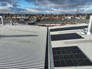 Overview of the overclad roof, demonstrating the transformation from asbestos to metal profile.