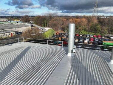 The new edge protection around the perimeter of the metal profiled roof