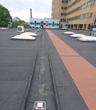 Detailed shot of the sumped gutter, showcasing its design and how it integrates with the overall roofing system.