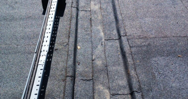 Image focusing on the drainage system of the roof, showcasing its efficiency and integration with the sumped gutters.