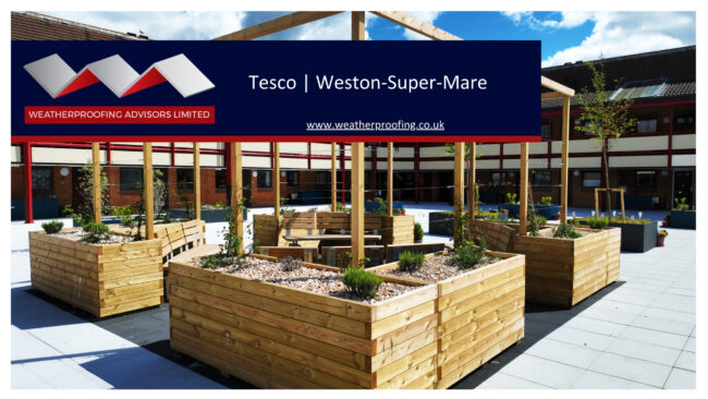 Wooden planters and seating area in a modern outdoor space at Tesco Weston-Super-Mare, designed and constructed by Weatherproofing Advisors Limited.