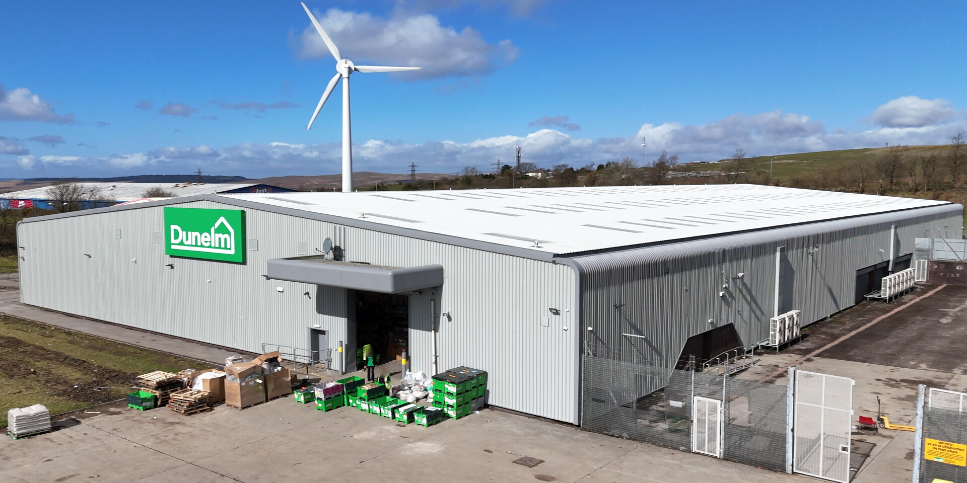 Refurbished roof and gutters at Dunelm Merthyr Tydfil with new insulation, rooflights, and mansafe safety system installed by Weatherproofing Advisors.